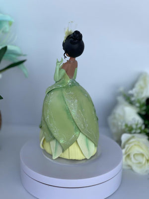 Princess Tiana two tier cake, one tier strawberry, the other tier vanilla.  All decor made by hand by Simply from Scratch! | By Simply From Scratch  est. since 2000Facebook